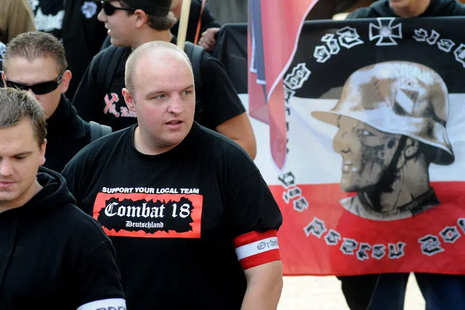 Obwohl Combat 18 offen als Teilorganisation von Blood & Honour agiert, blieb das militante Netzwerk in der Bundesrepublik vom Verbot von Blood & Honour unbeeindruckt. Deutsche Neonazis, welche dem Netzwerk zugerechnet werden, verwenden bis heute nahezu selbstverständlich das Logo und Erklennungszeichen der terroristischen Organisation und propagieren damit, unter den Augen der Sicherheitsbehörden die dort innewohnende Zielsetzung.
